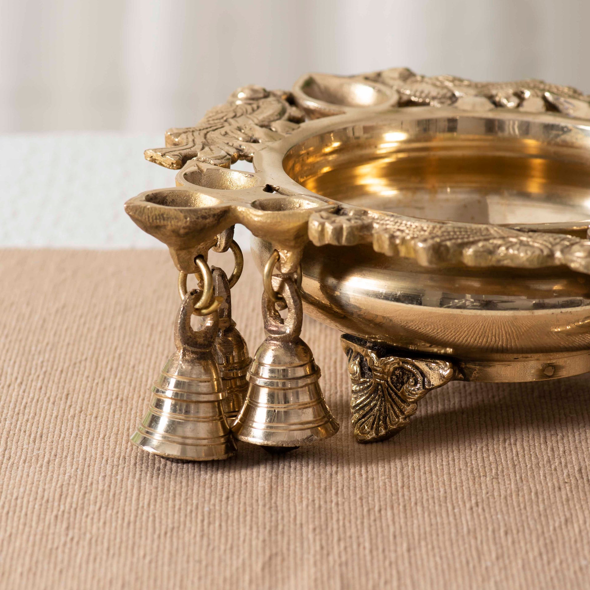 Brass Decorative Urli With Peacock and Bells - 8 Inch